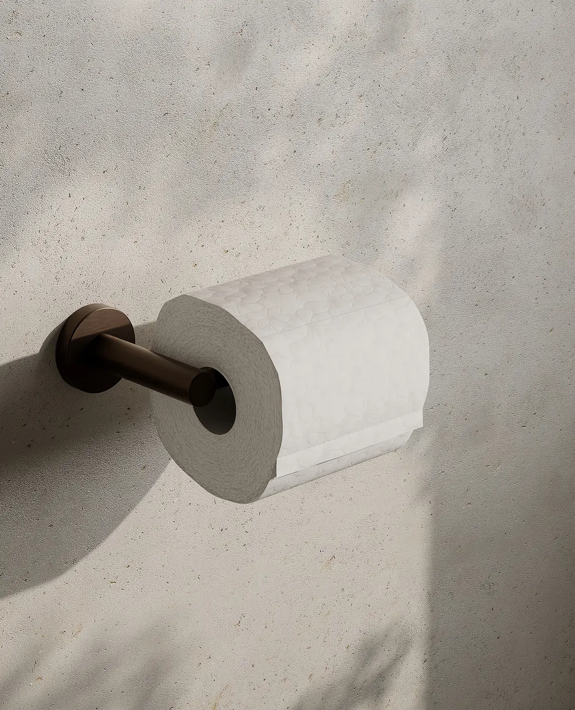 Render of a toilet roll holder in satin bronze with a roll of paper on a stone wall