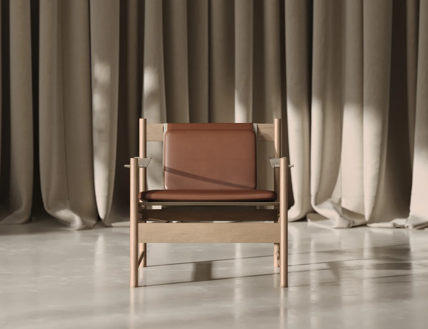 Front render of an oak lounge armchair with tan leather seat and back cushions in front of linen curtains