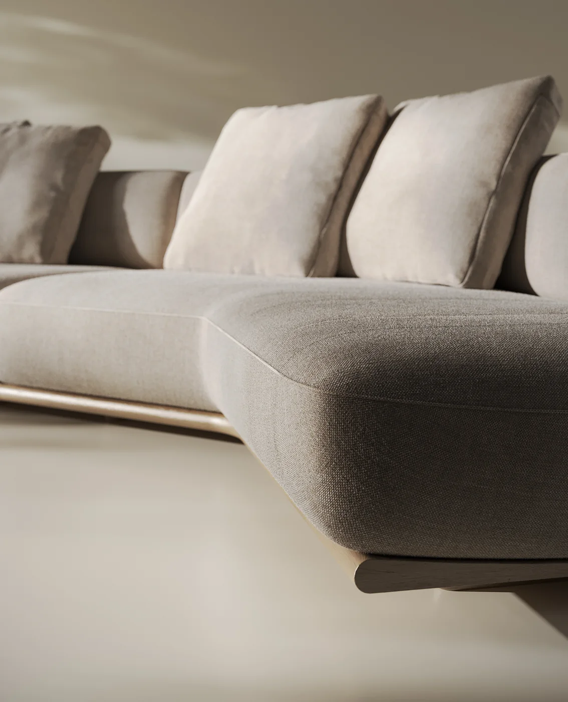 Close-up render of a light upholstered modular sofa with loose cushions on a low base with a metallic edge