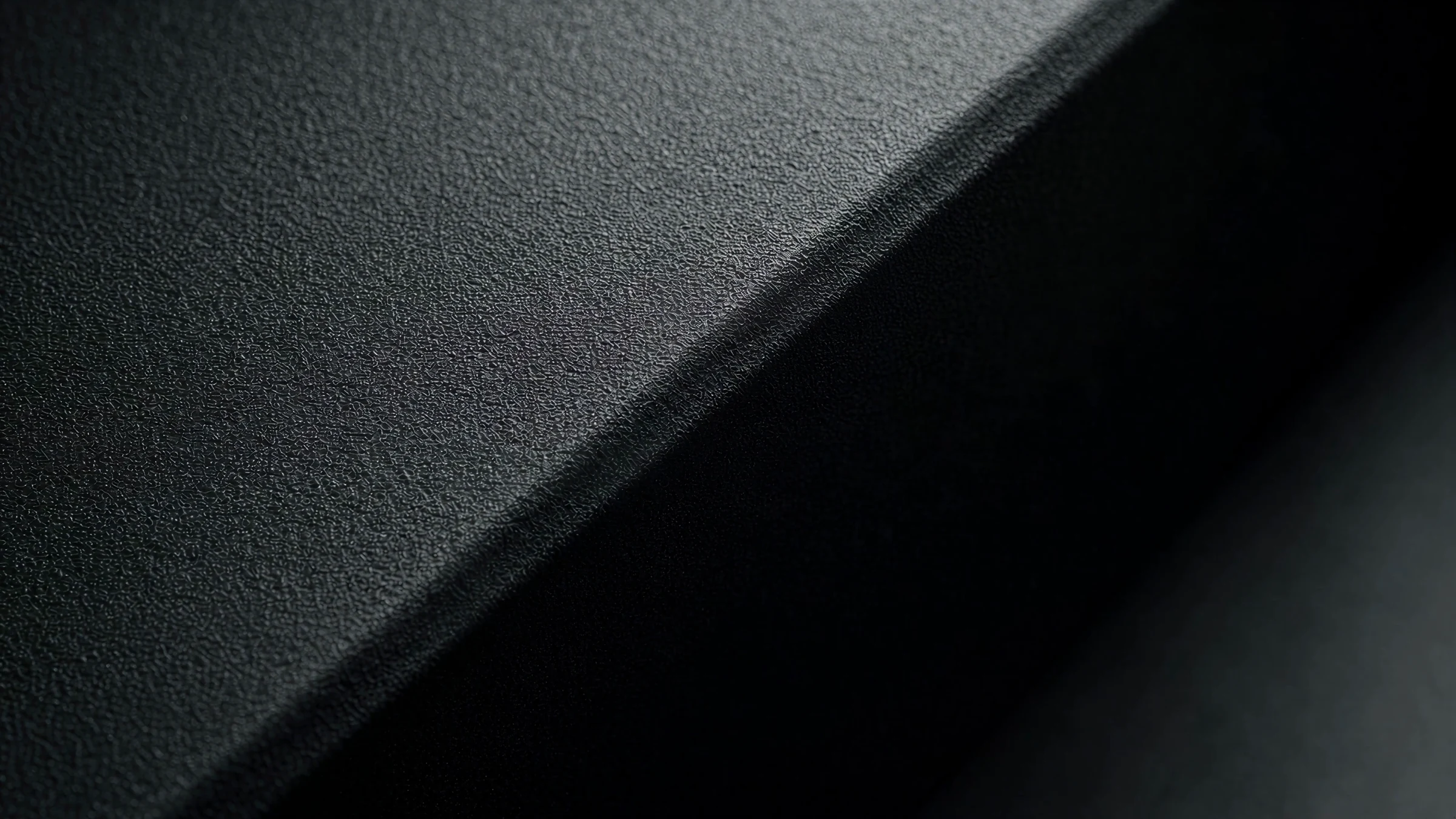 Macro of the textured matte housing of the eye tracker in low light