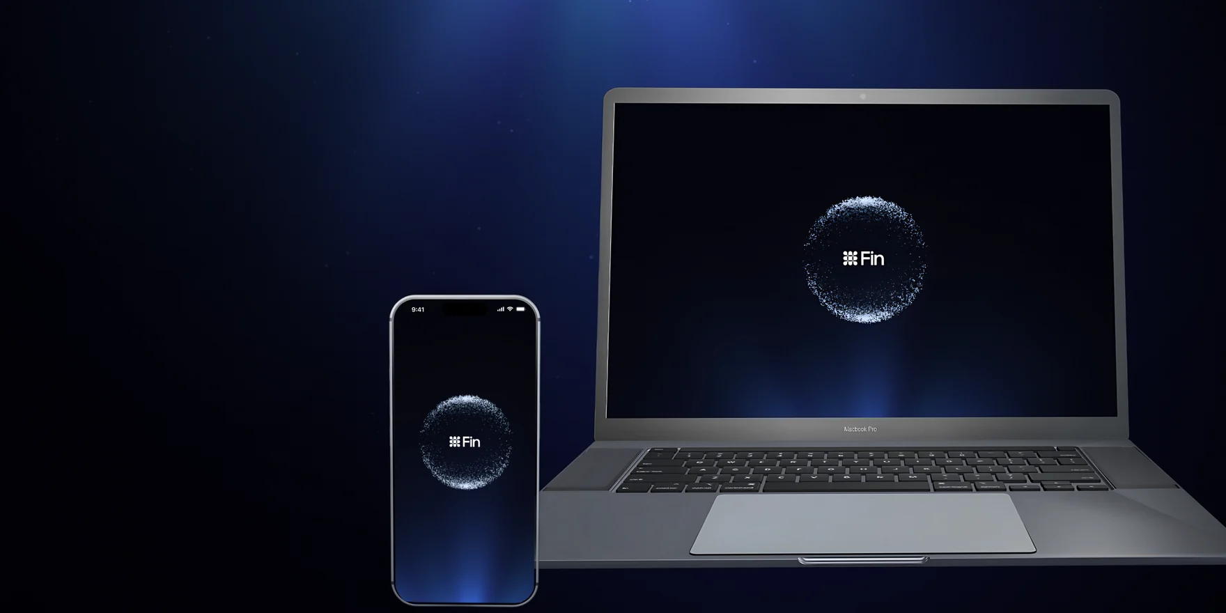 Laptop and phone on a dark stage, both showing the Fin particle sphere, from a concept launch film for Fin by Intercom