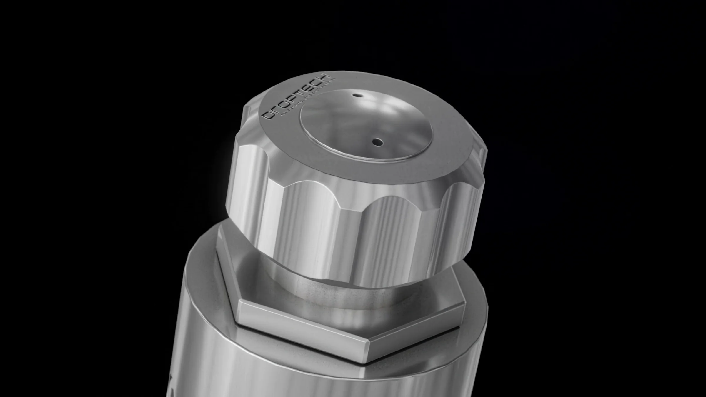 Close-up still of the valve nozzle with its knurled cap and outlet