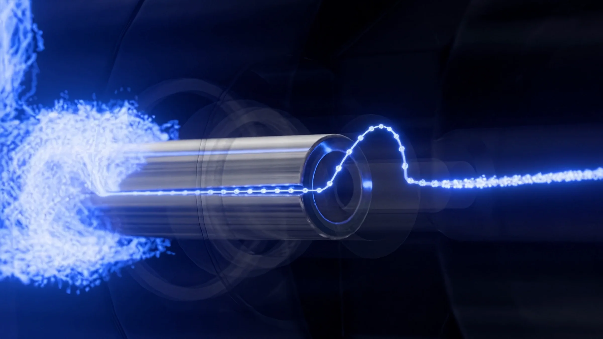 Still of blue fluid particles entering the valve and leaving as a thin line of droplets