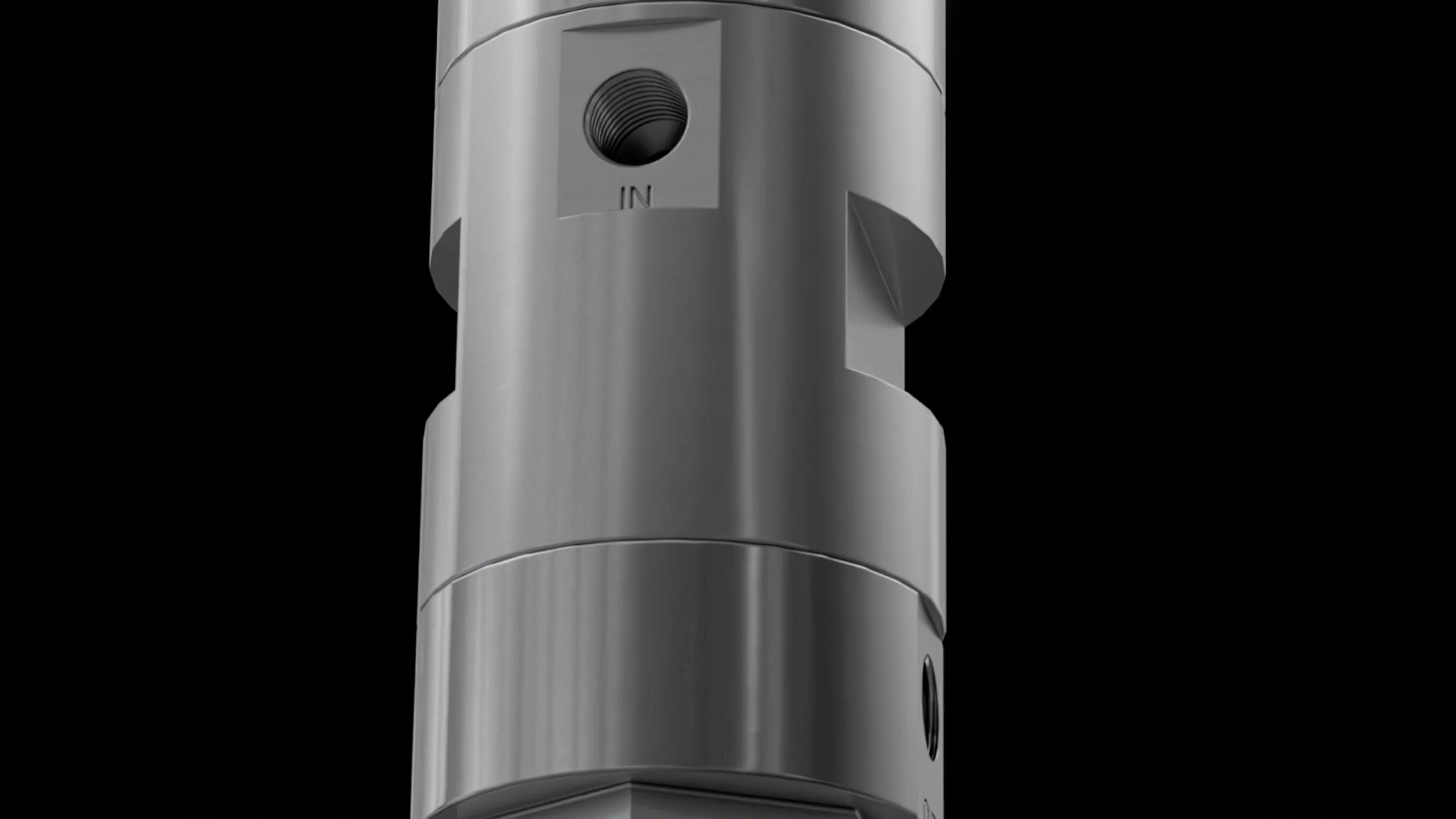 Close-up still of the machined steel valve body with its inlet port