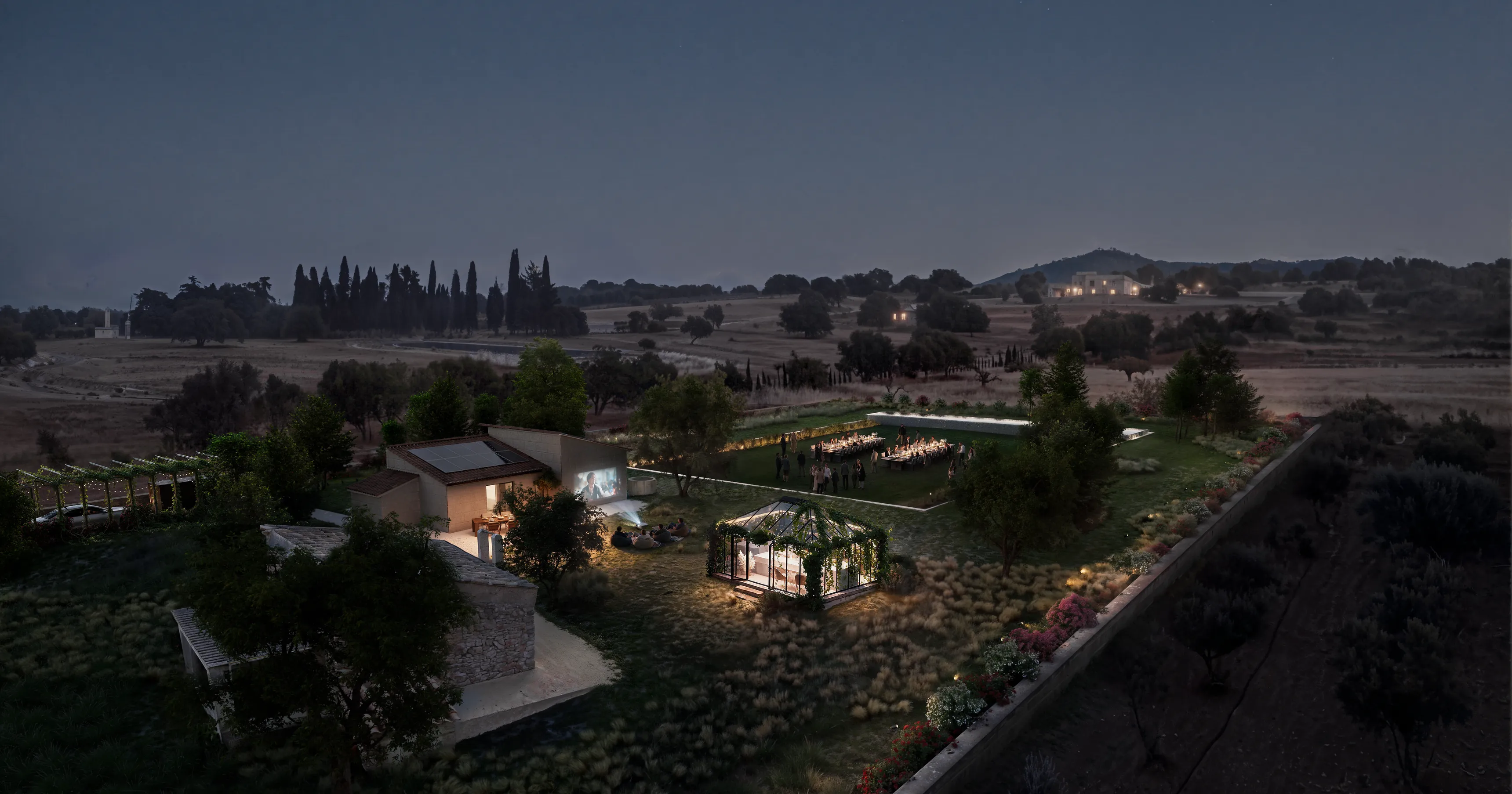 Render aéreo nocturno de una finca de Mallorca con invitados en largas mesas de cena, un invernadero iluminado y una película proyectada en la fachada de la casa