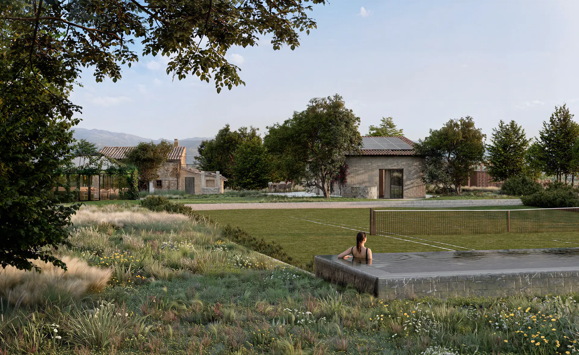 Render of a finca garden in Mallorca with a raised pool, swimmer, grass tennis court and stone buildings