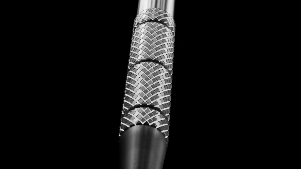 3D medical animation still of a knurled dental instrument handle on black