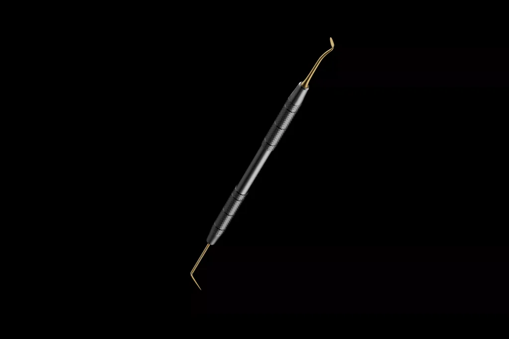 CGI of a dental scaler instrument lying diagonally on a black background