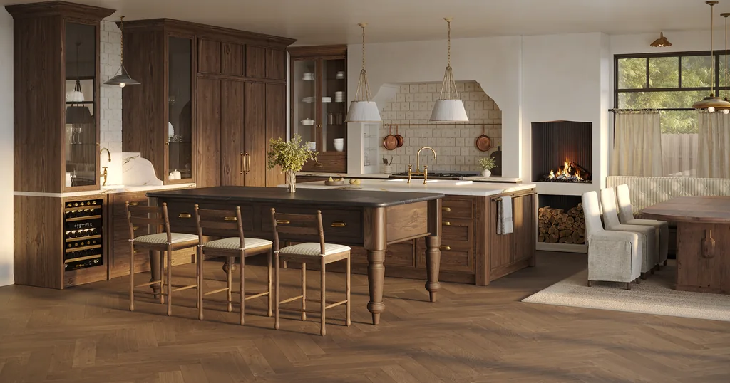 Wide render of a renovated walnut kitchen with a turned-leg island, four stools, a tiled range alcove, a wood-burning fireplace and a linen banquette