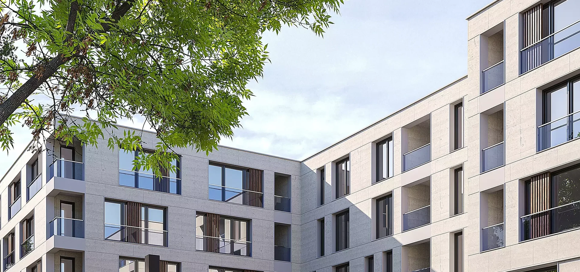 Render of modern apartment buildings with balconies around a green courtyard under a tree canopy