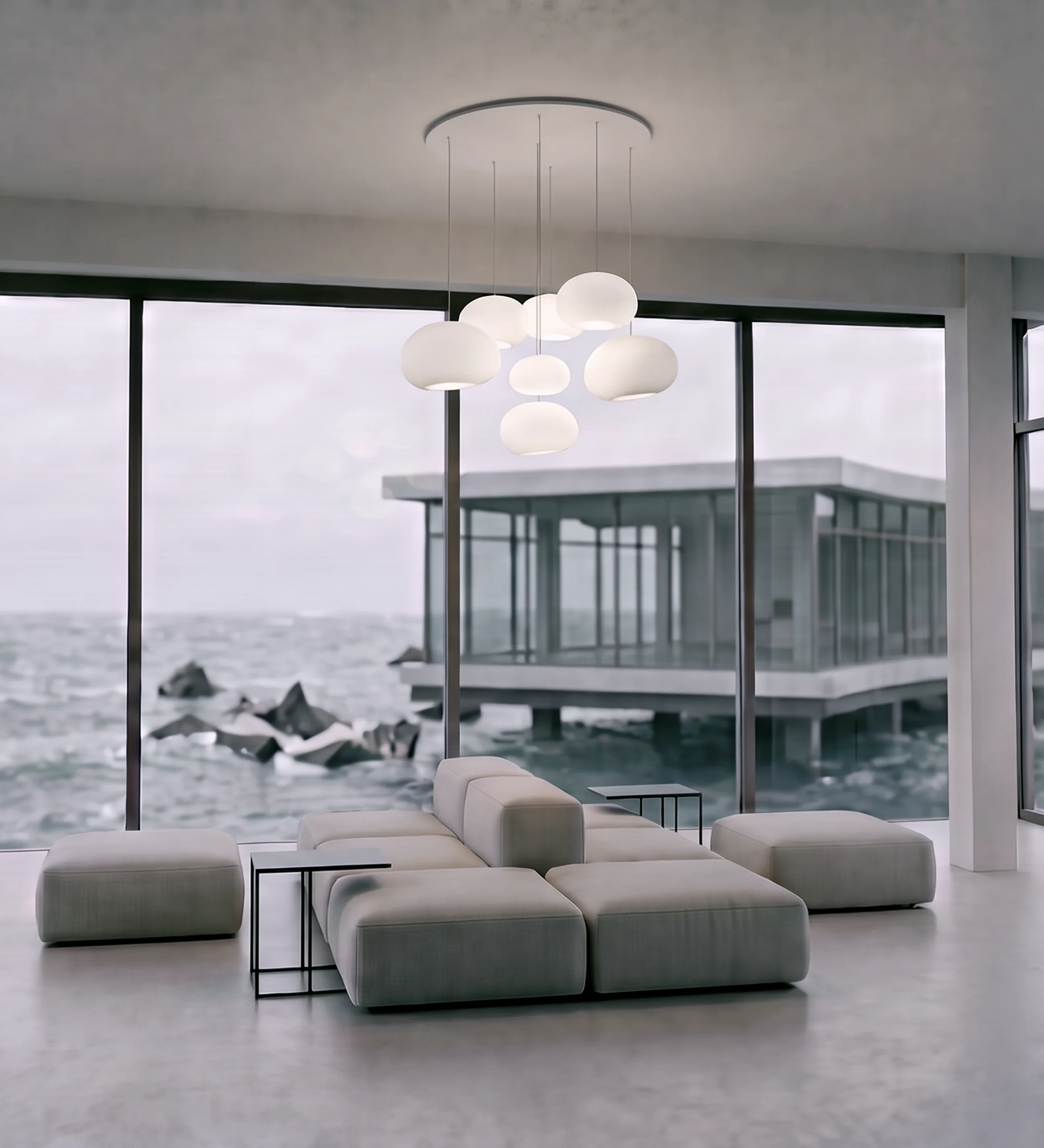 Render vertical de una zona de descanso con sofás modulares y lámparas colgantes, con vistas a un pabellón acristalado sobre pilotes bajo las nubes