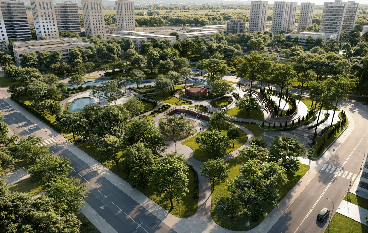 Aerial render of an urban park between residential towers and two streets, with curved paths, pools, an amphitheatre and mature trees