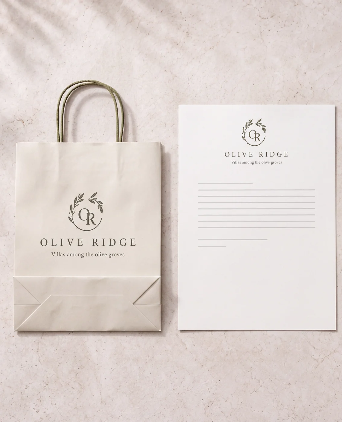 Olive Ridge stationery: paper bag, letterhead and envelope with the olive branch logo