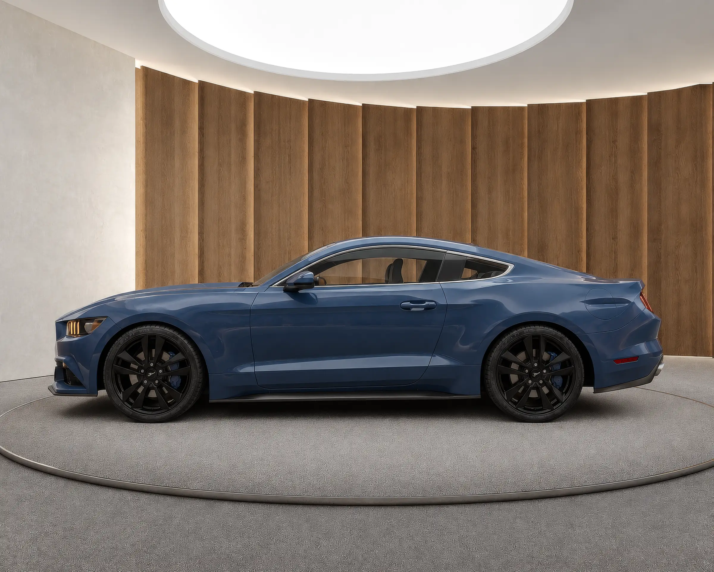 Rendering of a blue sports coupe in side profile in a walnut panelled virtual car showroom with a round skylight and a grey platform