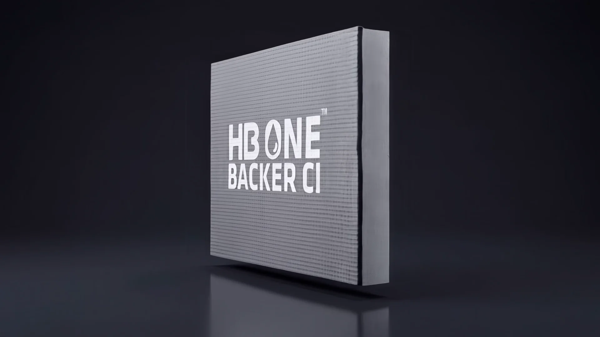 Exploded-View Wall System Animation for an Insulated Backer Board Still from the animation: an insulated backer board with an embossed grid face standing on a dark reflective floor