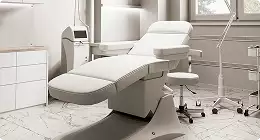 Clean treatment room, 3d interior rendering services, with exam chair, stool, cabinets, and window light