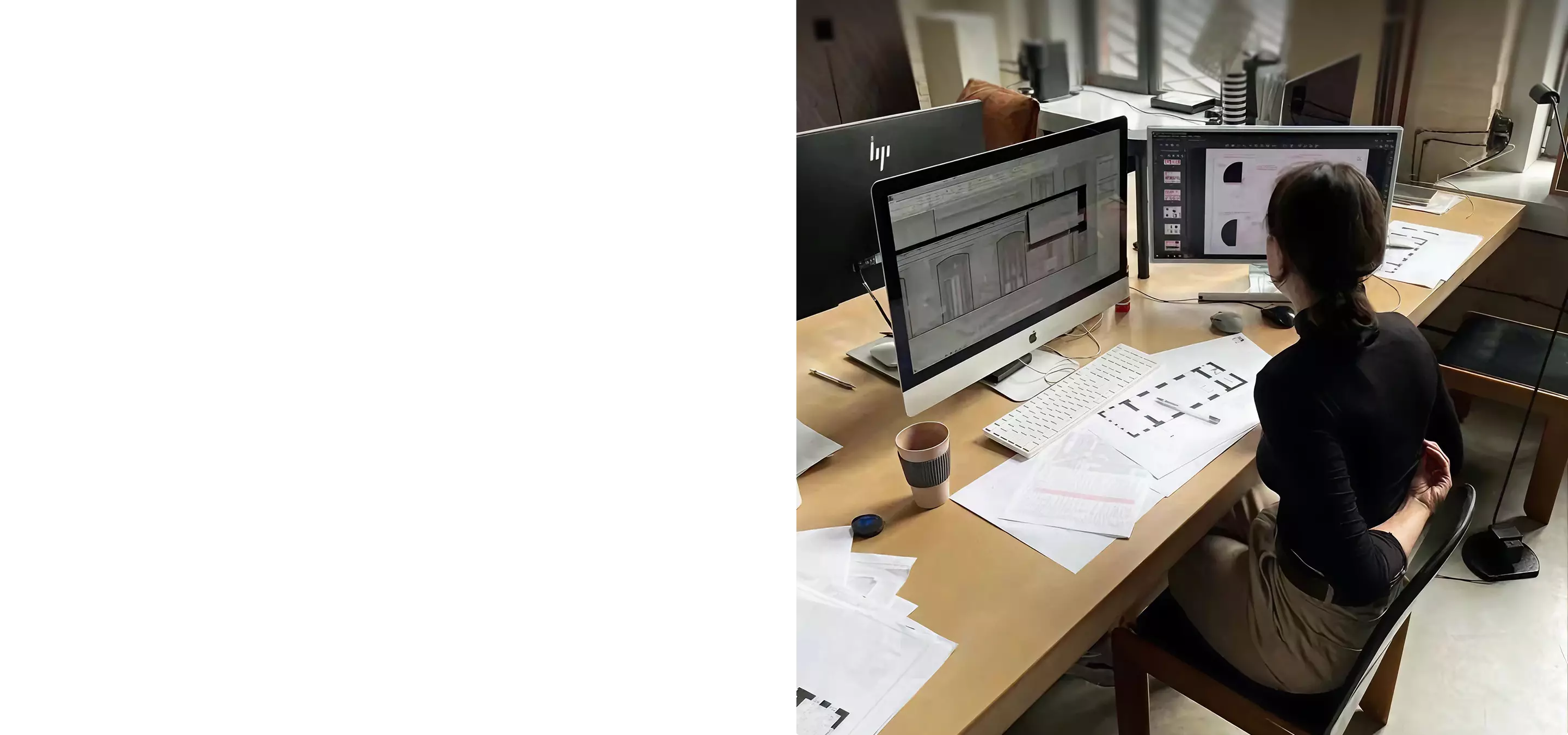 Designer at desk using 3Ds Max on dual monitors with plans, 3Ds Max a legend or a versatile software