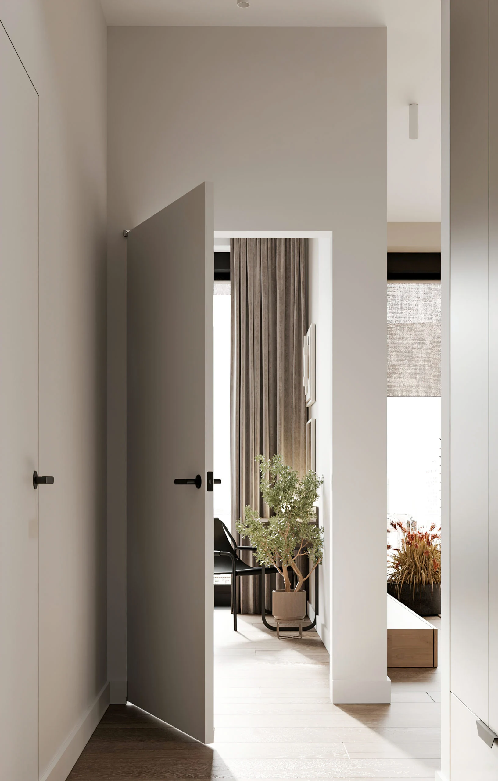 Neutral hallway leading to bright living space with plant, curtain, and wall art