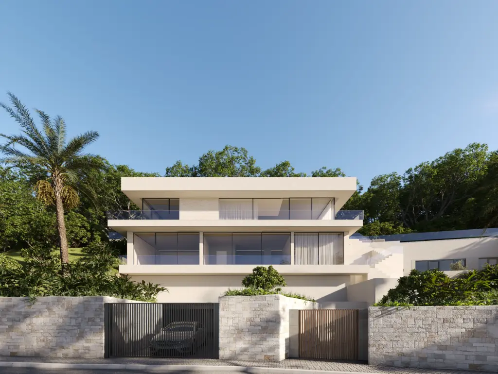 Modern multi-level villa exterior with clean lines, stone walls, and lush greenery