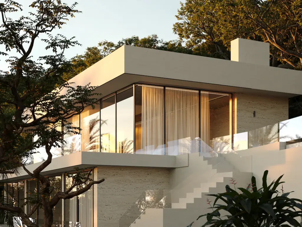 Contemporary hillside villa with terraces and warm interior lighting