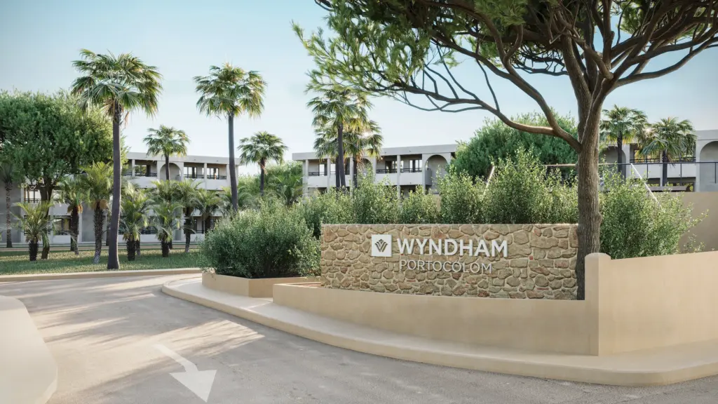 Residential entrance signage with landscaped greenery and modern architecture