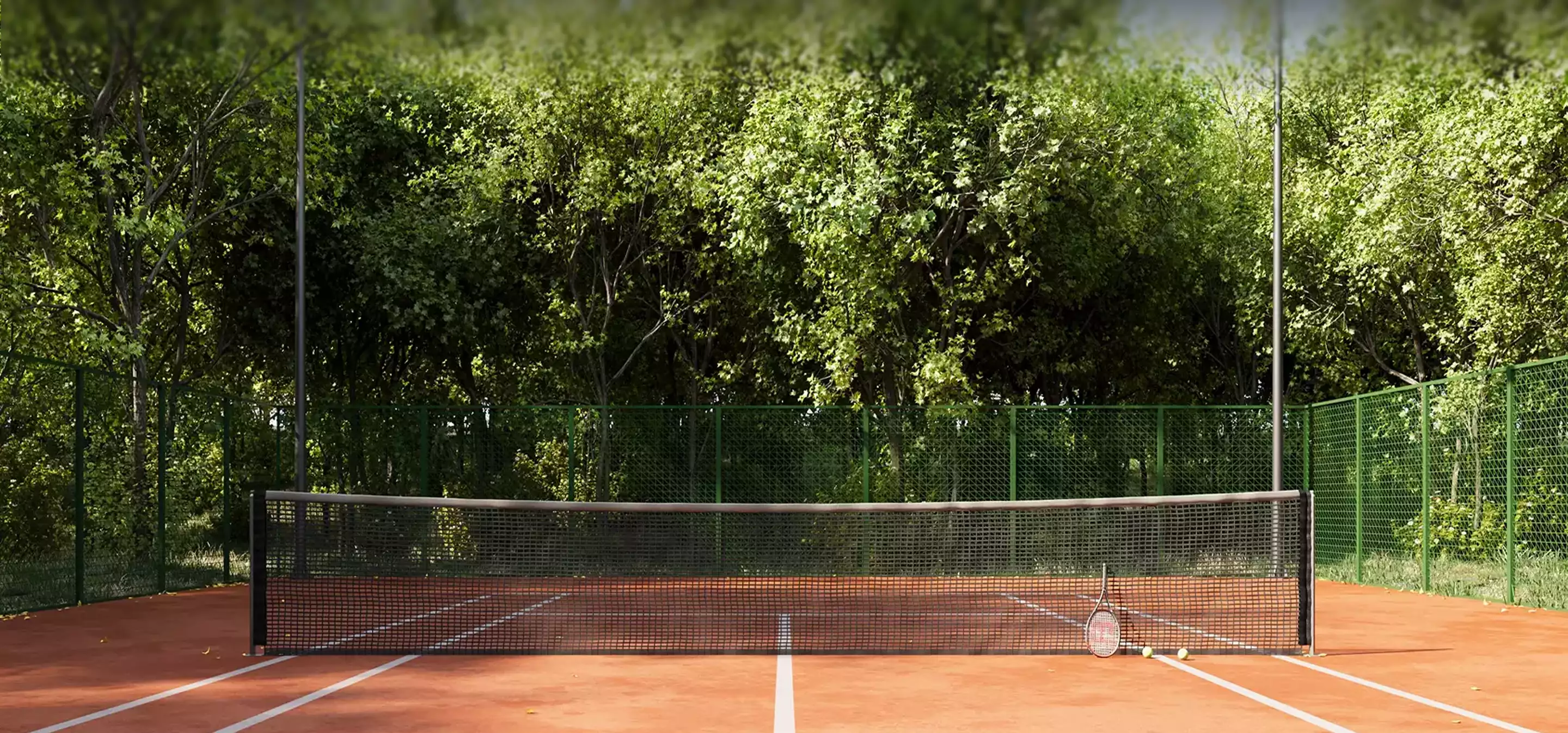 Empty tennis court with net and trees, top 3D architectural rendering companies in 2026