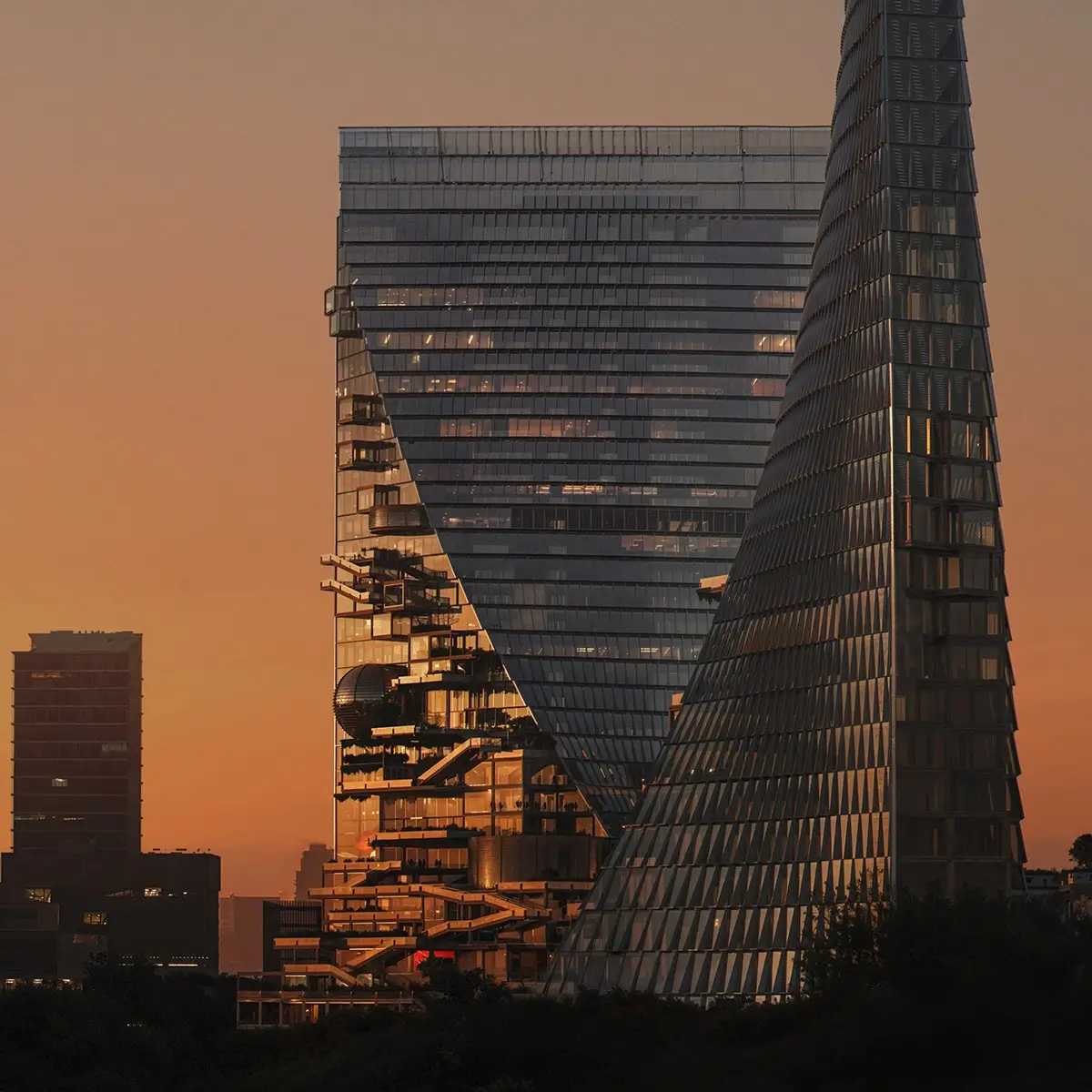 Sculptural high-rise towers at sunset shown in a 3D architectural visualization portfolio