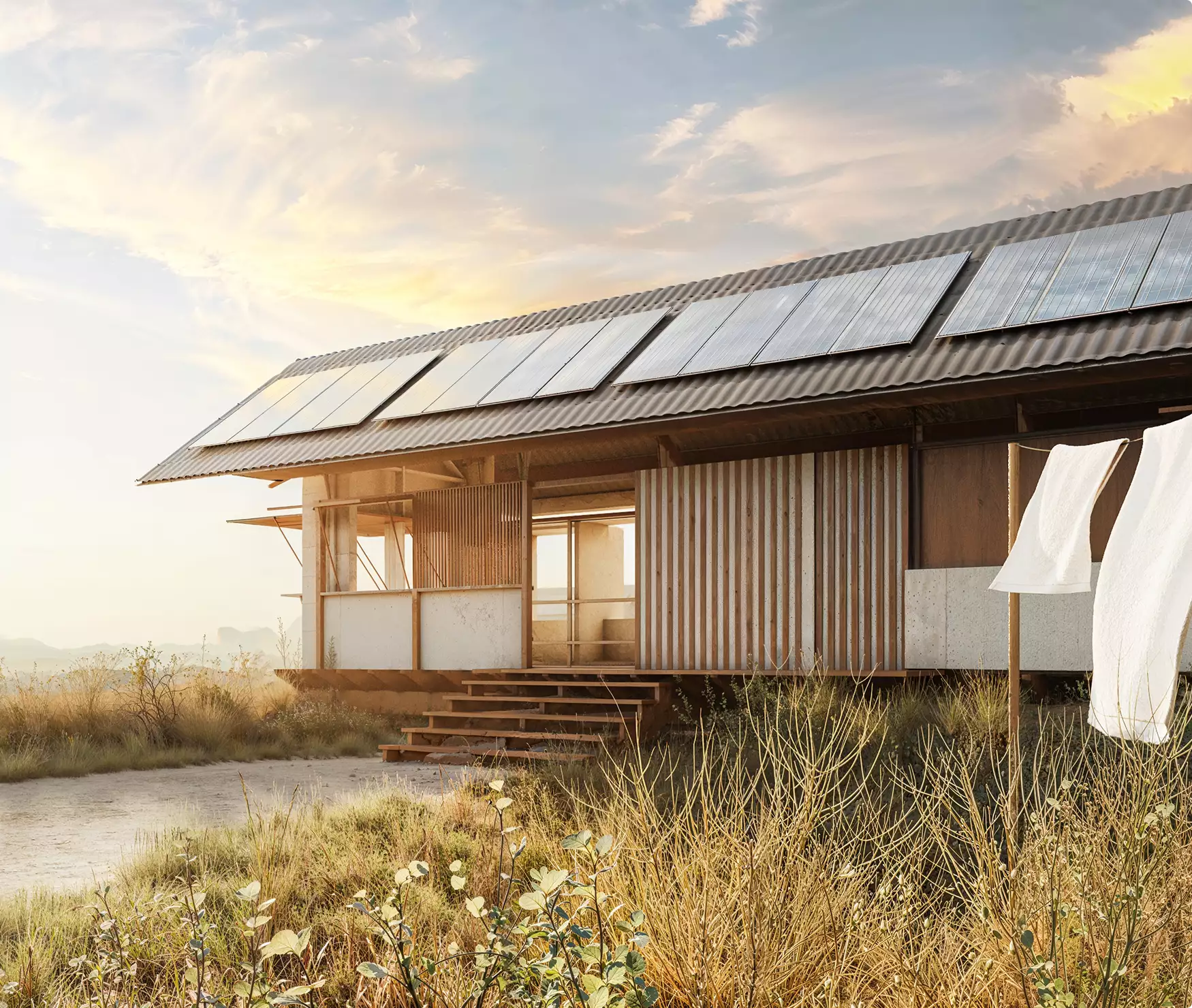 Eco houses design with modern rural home and rooftop solar panels in dry grass landscape