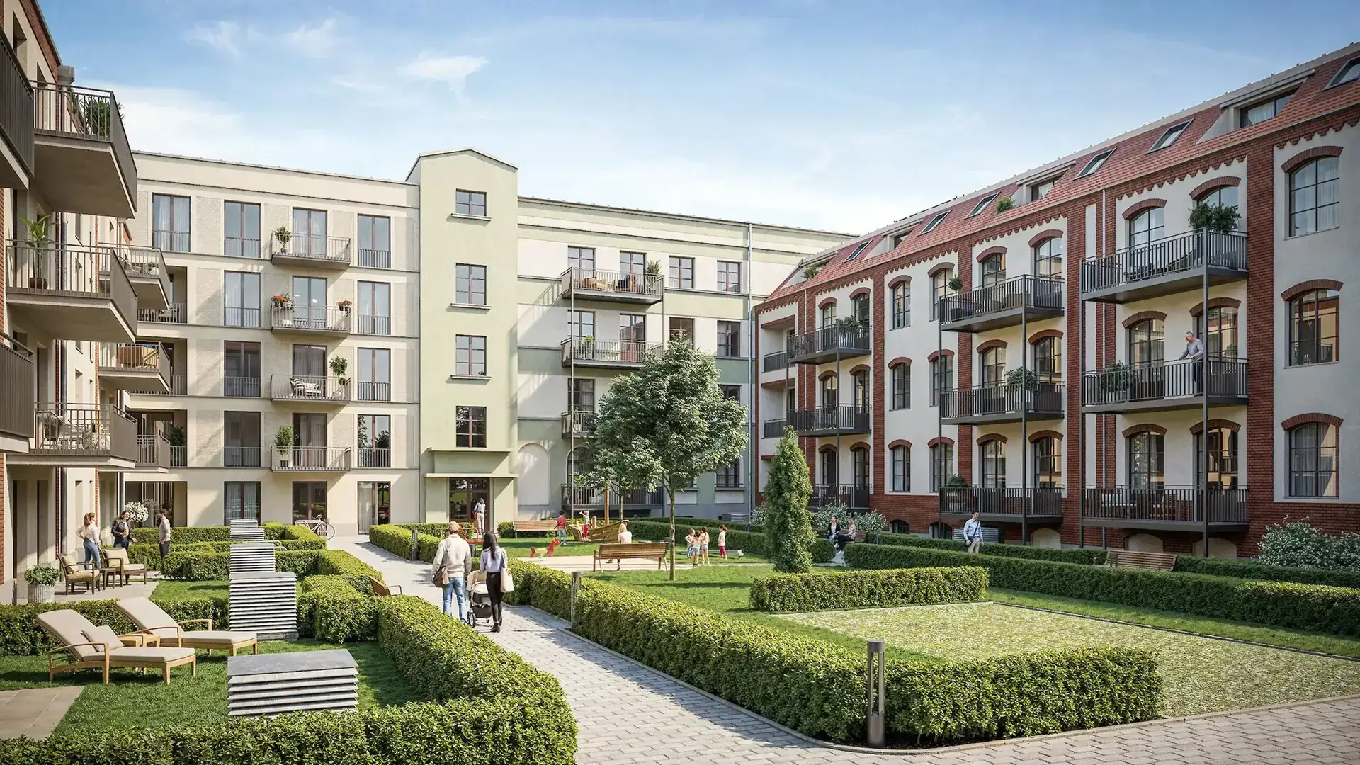 Inner courtyard of a residential block with landscaped lawns, walkways, benches, and people relaxing outdoors