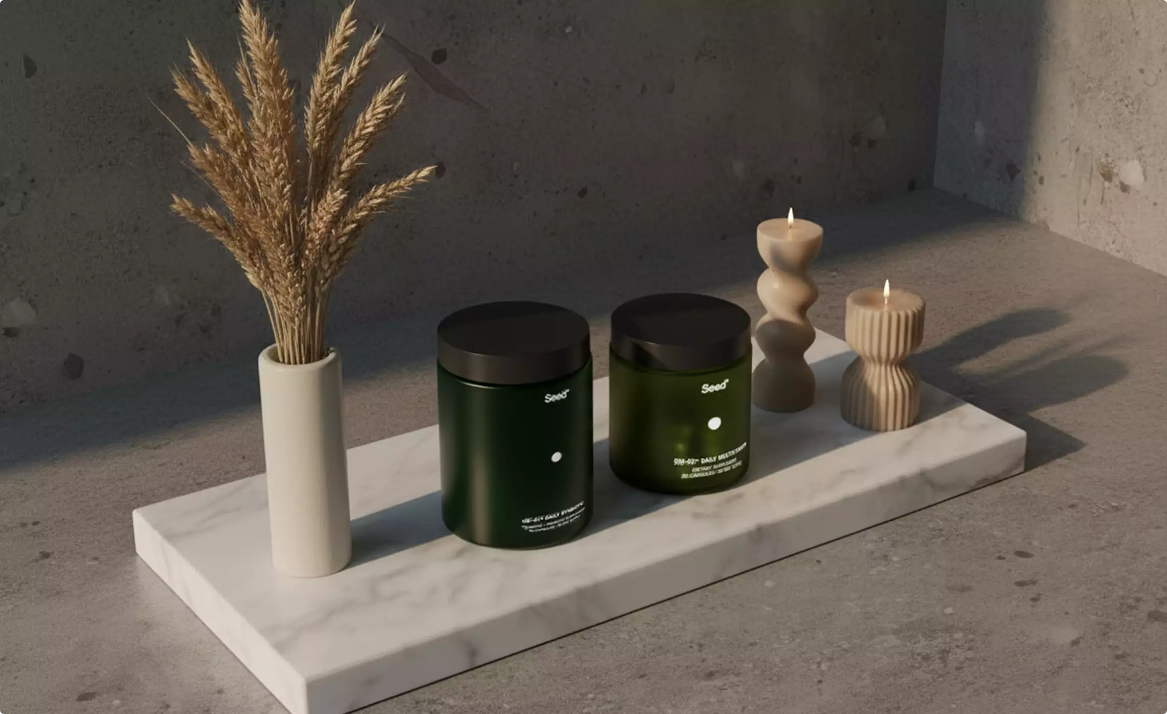 Two green Seed supplement jars on marble tray with wheat and candles, supplement packaging design