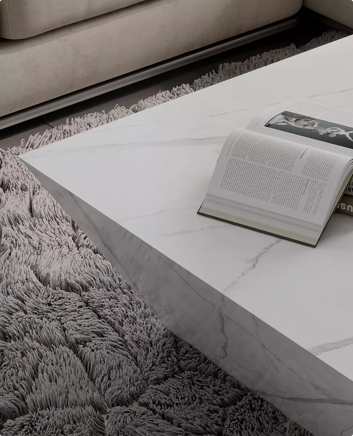 3d furniture rendering of white marble coffee table with open book on textured rug beside modern sofa