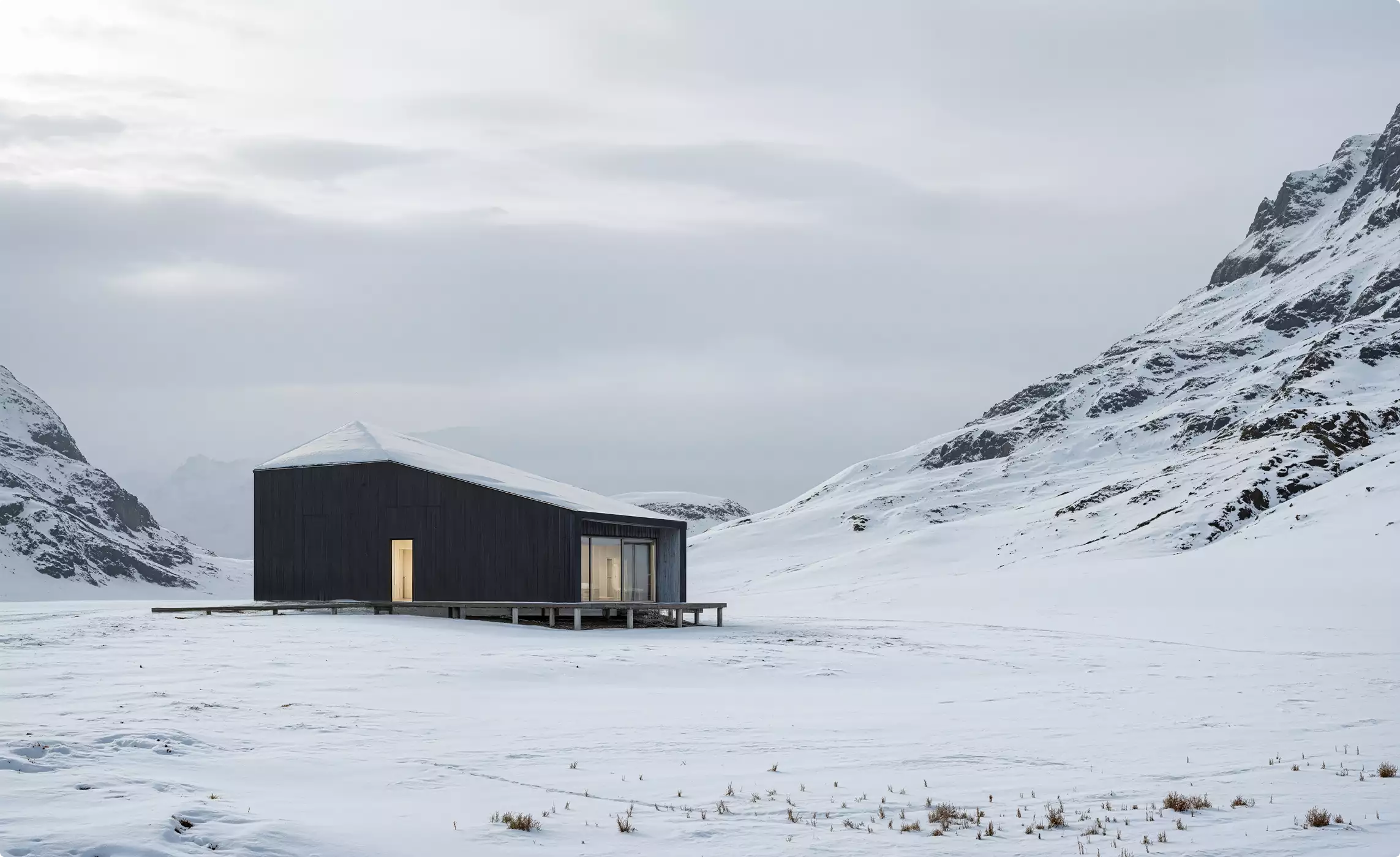 3D winter renders of a dark cabin in a snowy mountain valley under an overcast sky