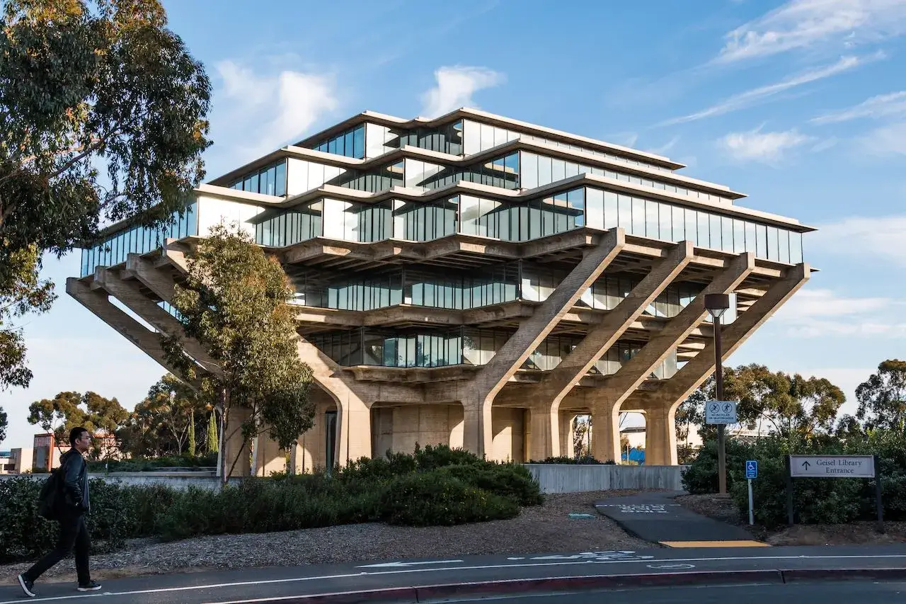 Brutalist architectural style Geisel Library with concrete base and stacked glass floors at UC San Diego campus
