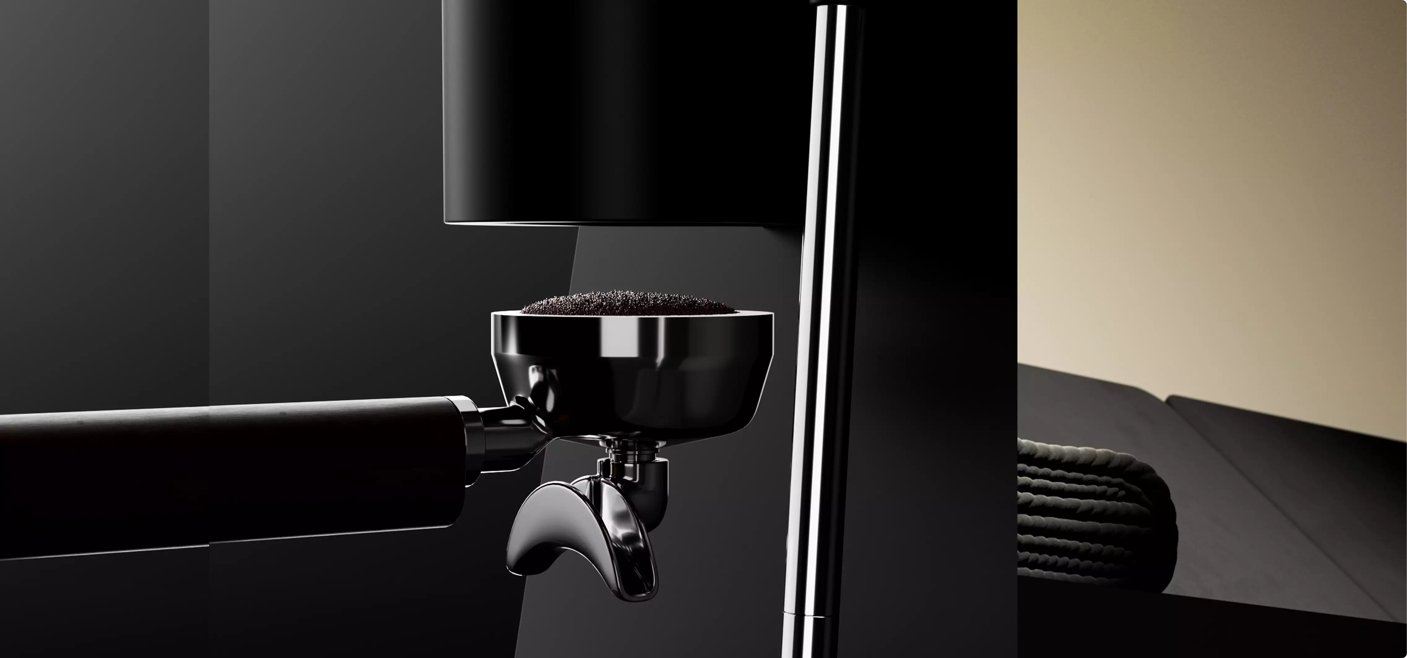 Chrome portafilter filled with coffee grounds under black espresso machine product design