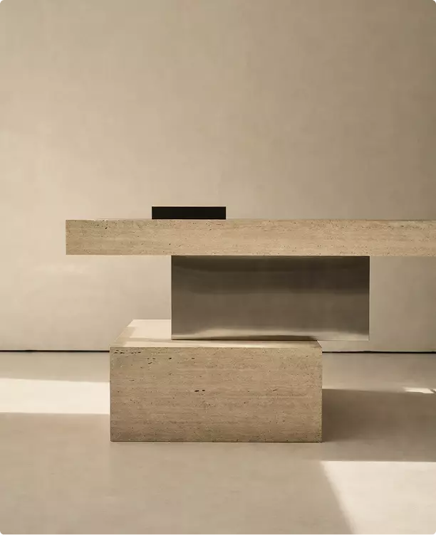 Stone reception desk in exhibition booth visualization with layered blocks and brushed metal panel