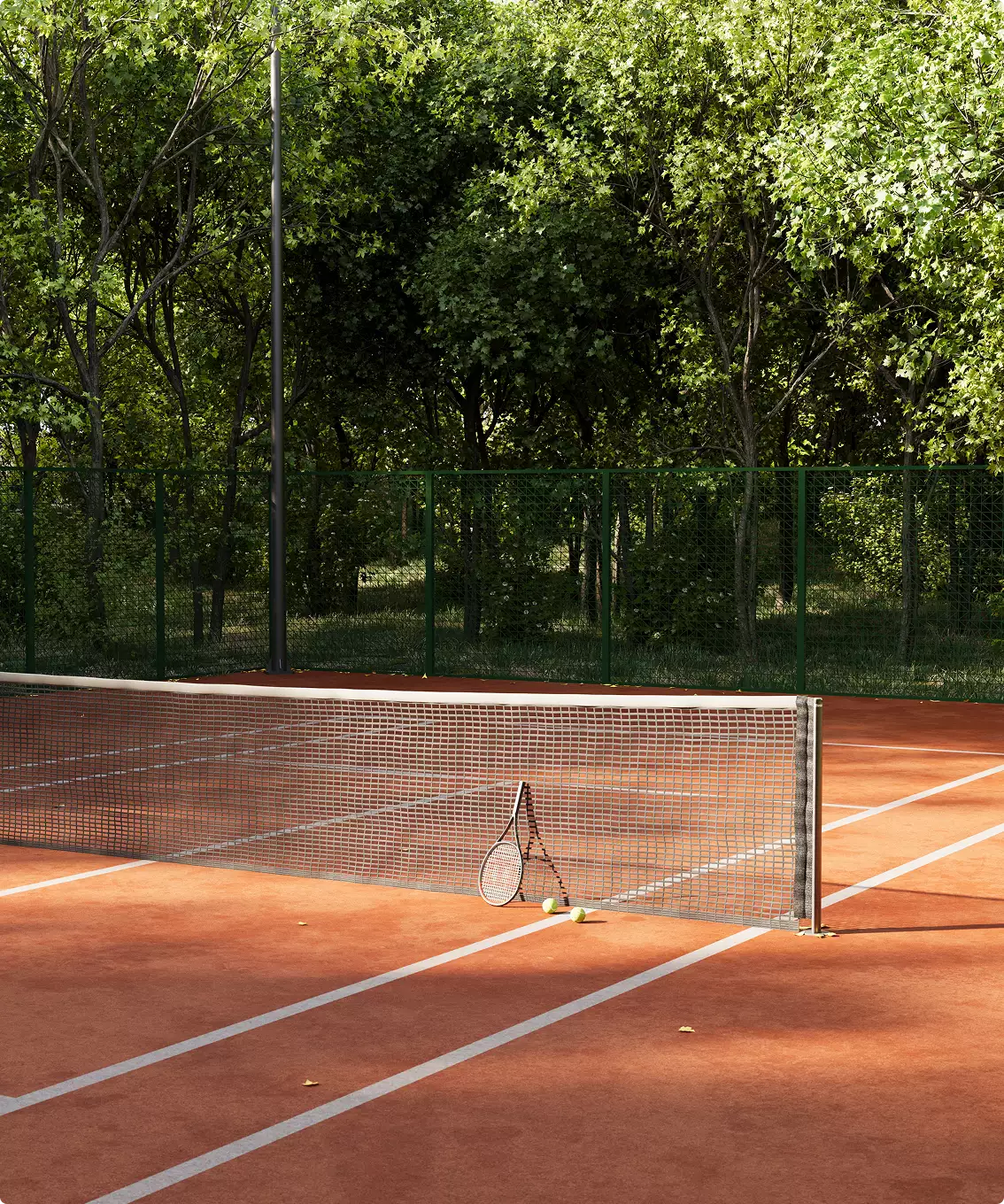 Clay tennis court design with forest backdrop, green fence, net, racket and ball in sunlight.