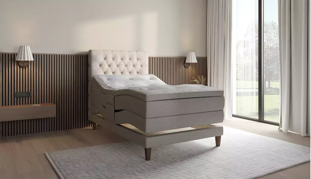 Adjustable upholstered bed with tufted headboard in modern bedroom interior furniture rendering
