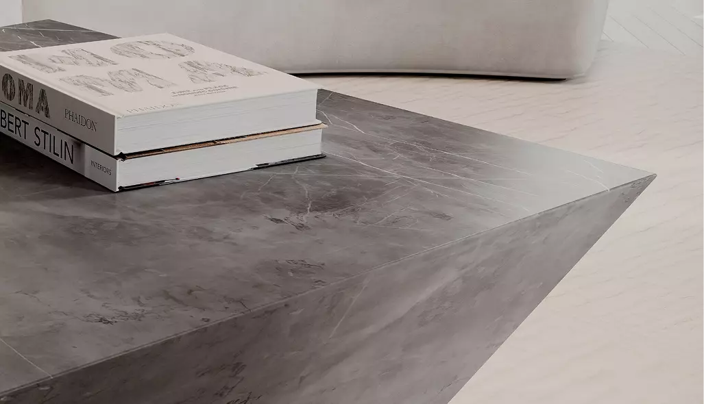 furniture renders dark marble coffee table with stacked books beside curved white sofa