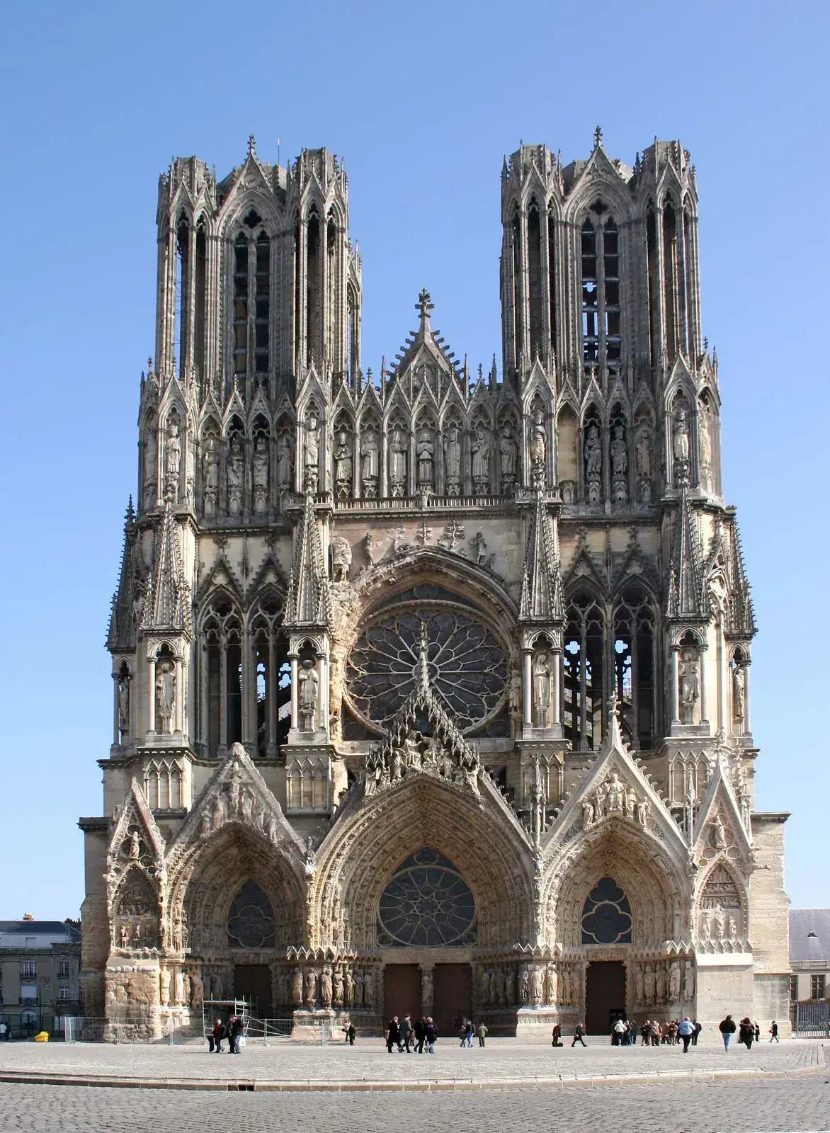 Gothic architectural style cathedral with pointed arches, rose window, and tall stone towers