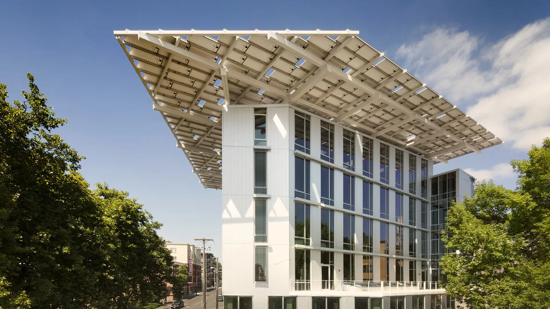 Green architecture office with solar canopy and glass facade, renewable energy sources and energy efficiency