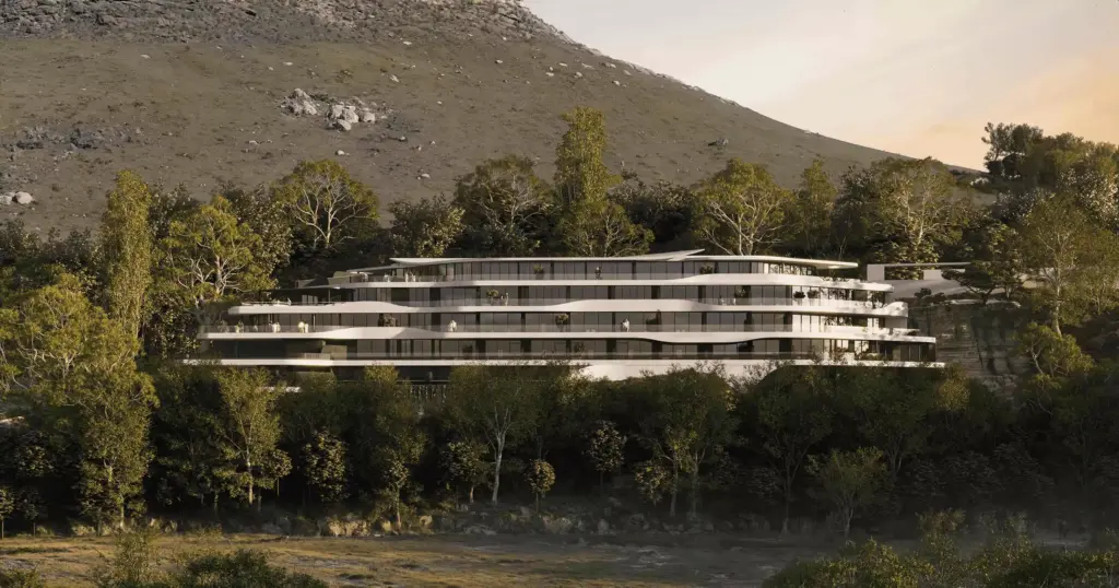 Hotel exterior of a terraced hillside resort with curved balconies, glass facade, trees, and mountain backdrop