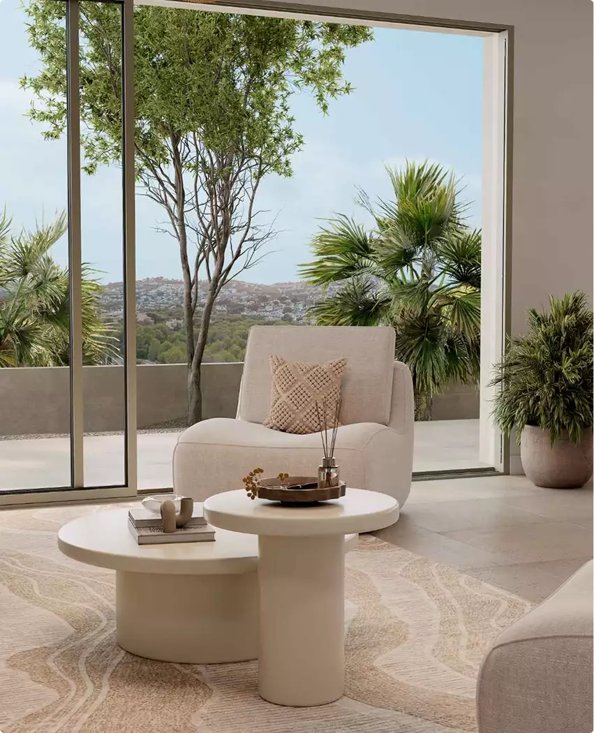 Living room with large window view, multifamily residential rendering, with chair, tables, and trees