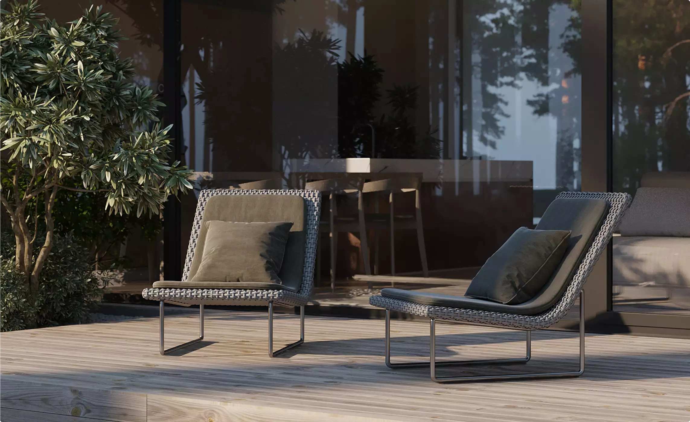 Minimalist design house terrace with woven lounge chairs on wood deck beside glass wall and forest view