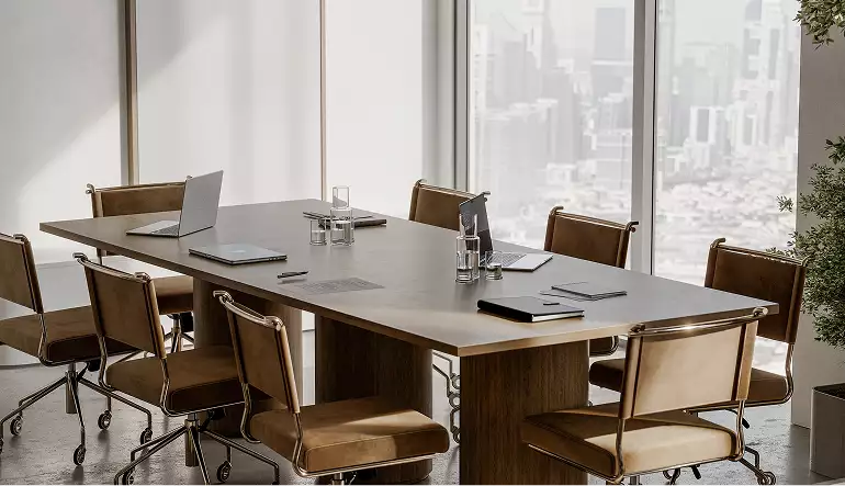 Modern office building rendering of a meeting room with leather chairs and a wood conference table