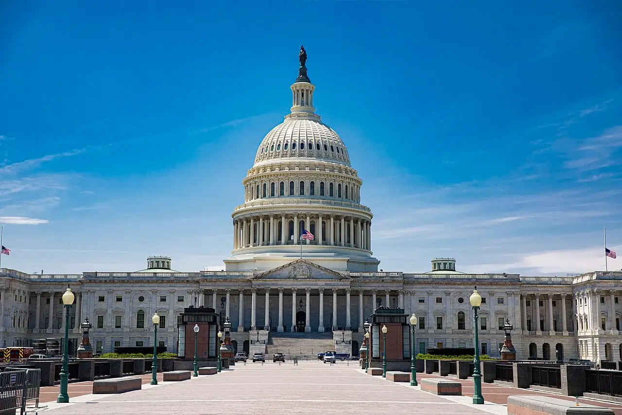 Neoclassical architectural style U.S. Capitol building with dome, columns, and symmetrical government facade in Washington DC