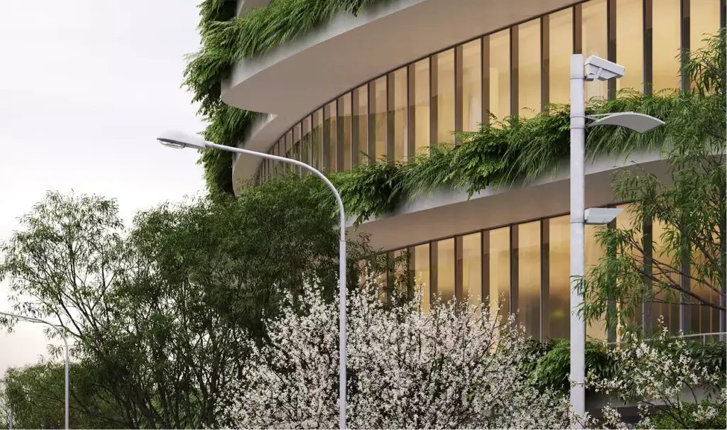 Office building renderings detail of a curved glass facade with planted terraces, trees, and streetlights