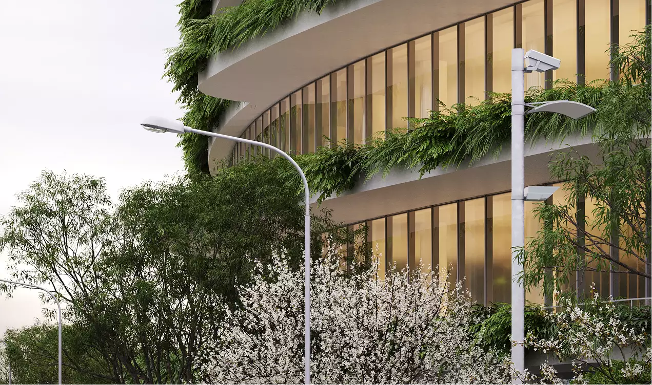 Office building renderings detail of a curved glass facade with planted terraces, trees, and streetlights