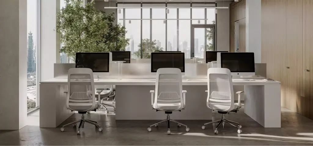 Office space animation of a shared desk area with desktop monitors, white chairs, and city windows