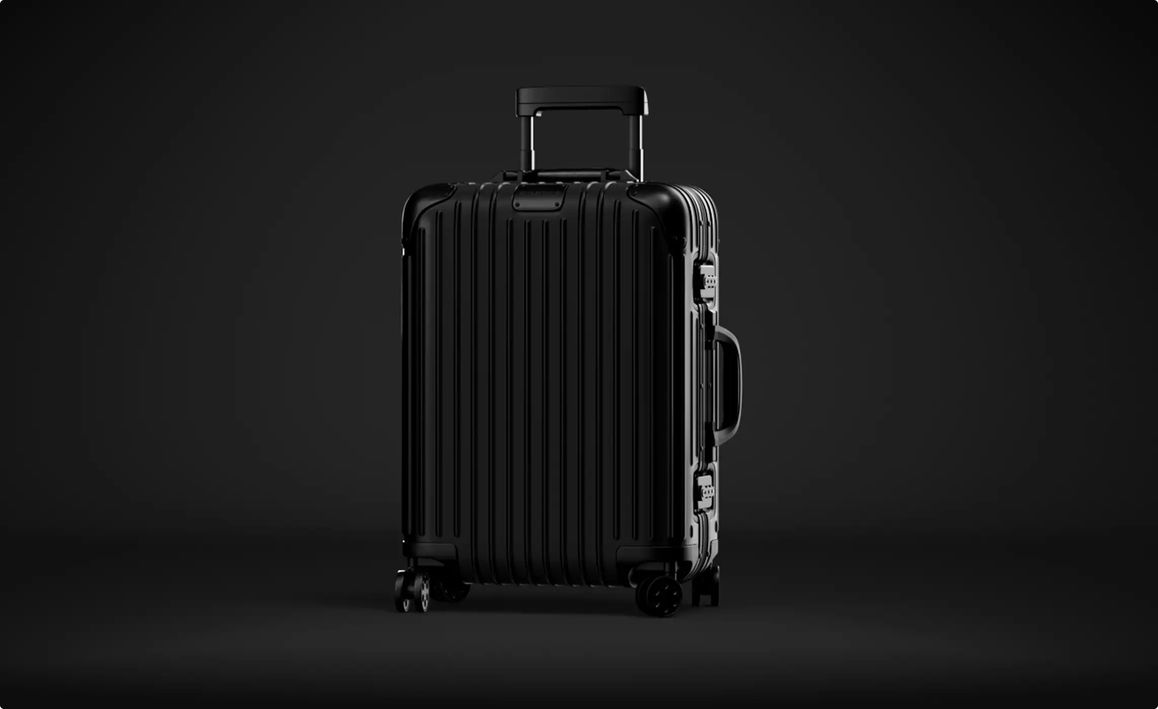 Product visualization services showing an upright black suitcase on a dark background