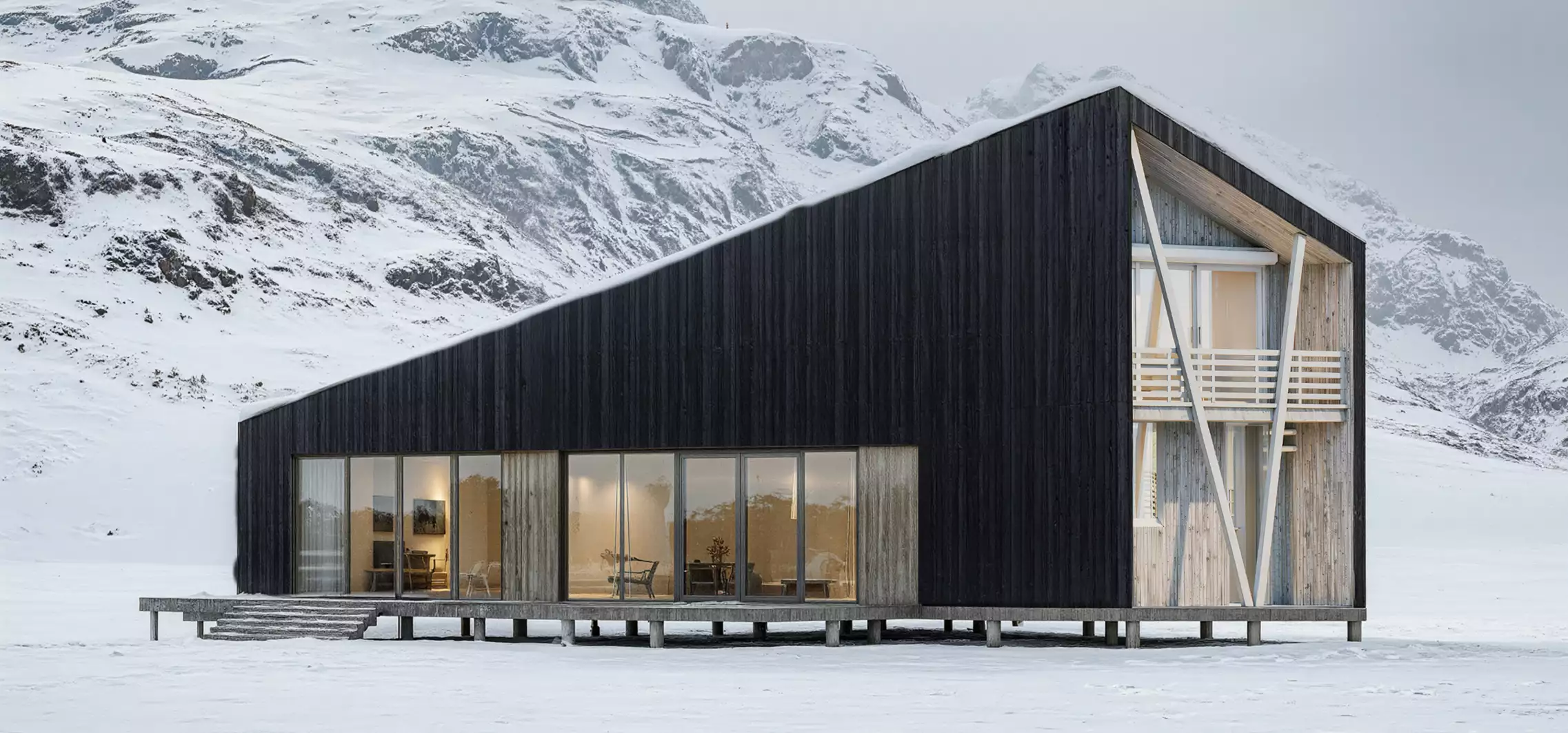 Rendering in winter of a modern black cabin with glass walls in a snowy mountain landscape